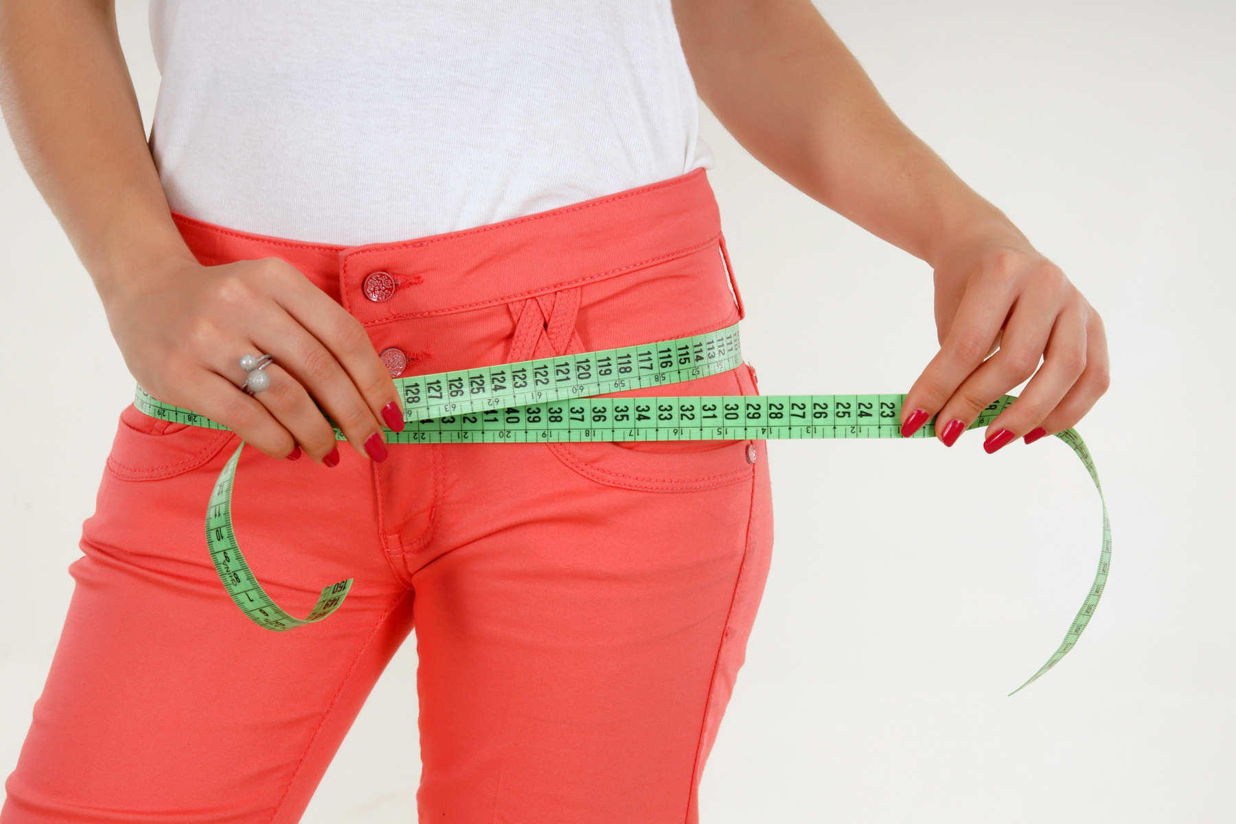 Woman measuring her hips